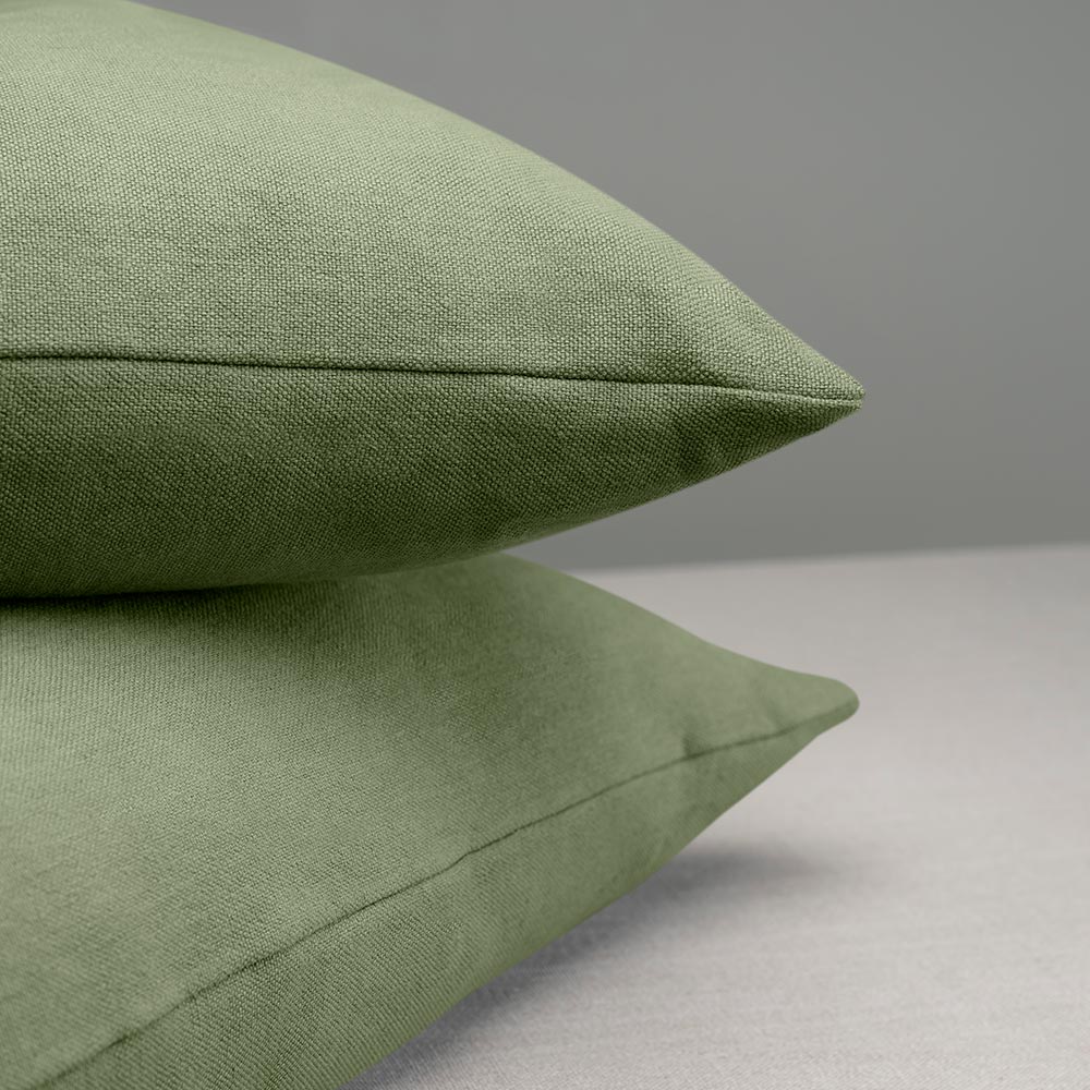 2 Square Kip Cushion in Laidback Linen, Moss on top of each other