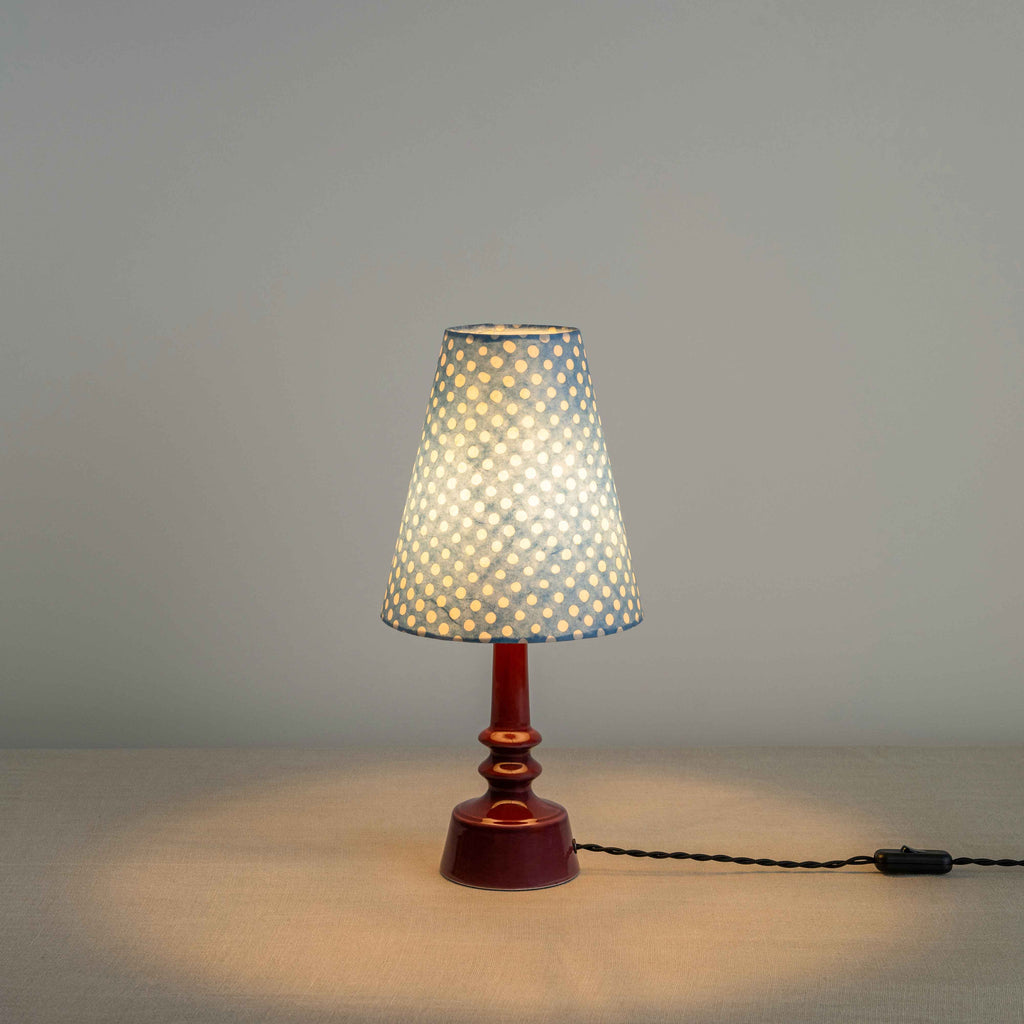 Ditsy Ceramic Table Lamp Base in Damson Pink, With Ditsy Tall Tapered Lamp Shade in Dotty Sky Blue, With Lights ON - Nicola Harding