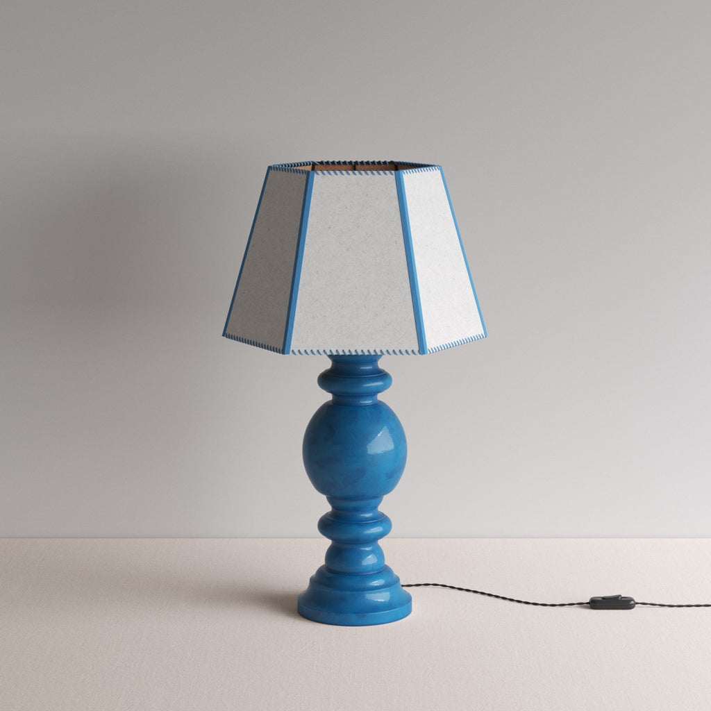 Hourglass Ceramic Table Lamp Base in Blue, With Townhouse Hexagonal Lamp Shade in Soft White with Peacock Blue Trim & Stitching - Nicola Harding