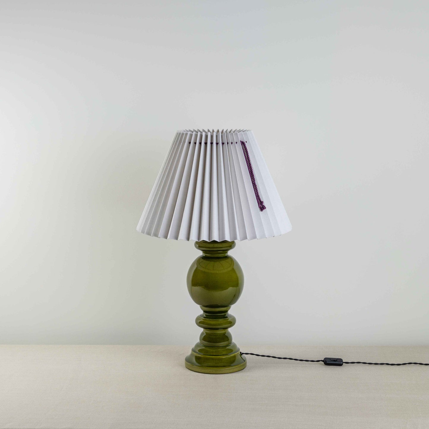 Hourglass Ceramic Table Lamp Base in Green, With Sunburst Concertina Natural Pleat Lamp Shade with Blackberry Cord - Nicola Harding