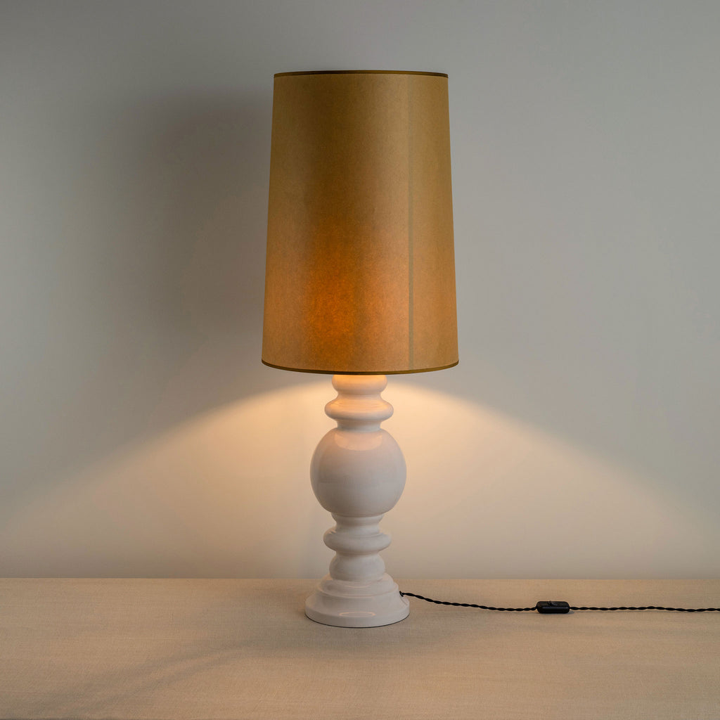 Hourglass Ceramic Table Lamp Base in White, With Whimsical Tall Straight Empire Lamp Shade in Mustard with Antiqued Gold Trim, With Lights 'ON' - Nicola Harding