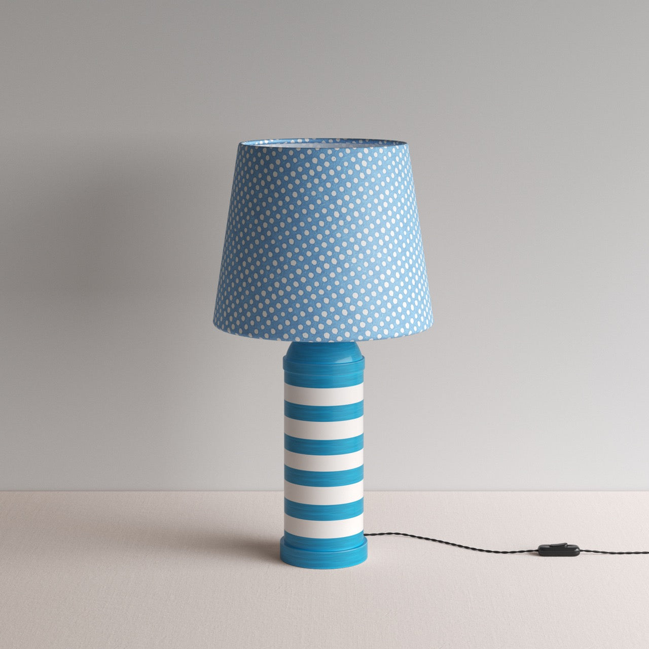 Humbug Striped Ceramic Table Lamp Base in Blue & Warm White, With Humbug Straight Empire Batik Paper Lamp Shade in Dotty Sky Blue - By NiX