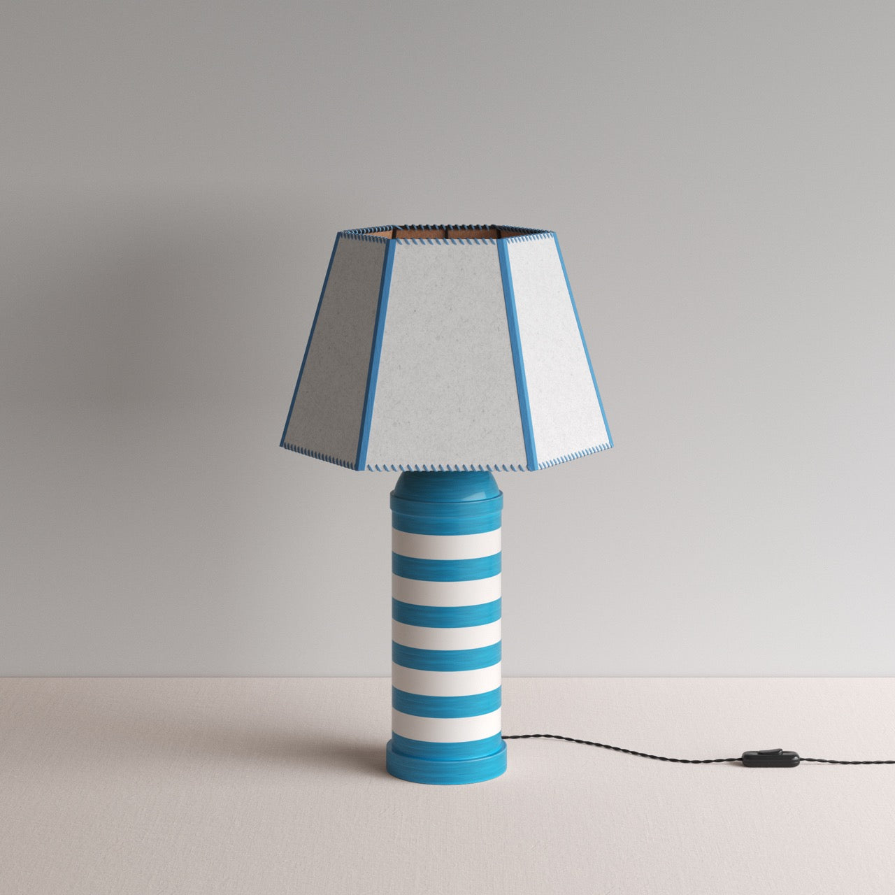 Humbug Striped Ceramic Table Lamp Base in Blue & Warm White, With Townhouse Hexagonal Lamp Shade in Soft White with Peacock Blue Trim & Stitching - By NiX