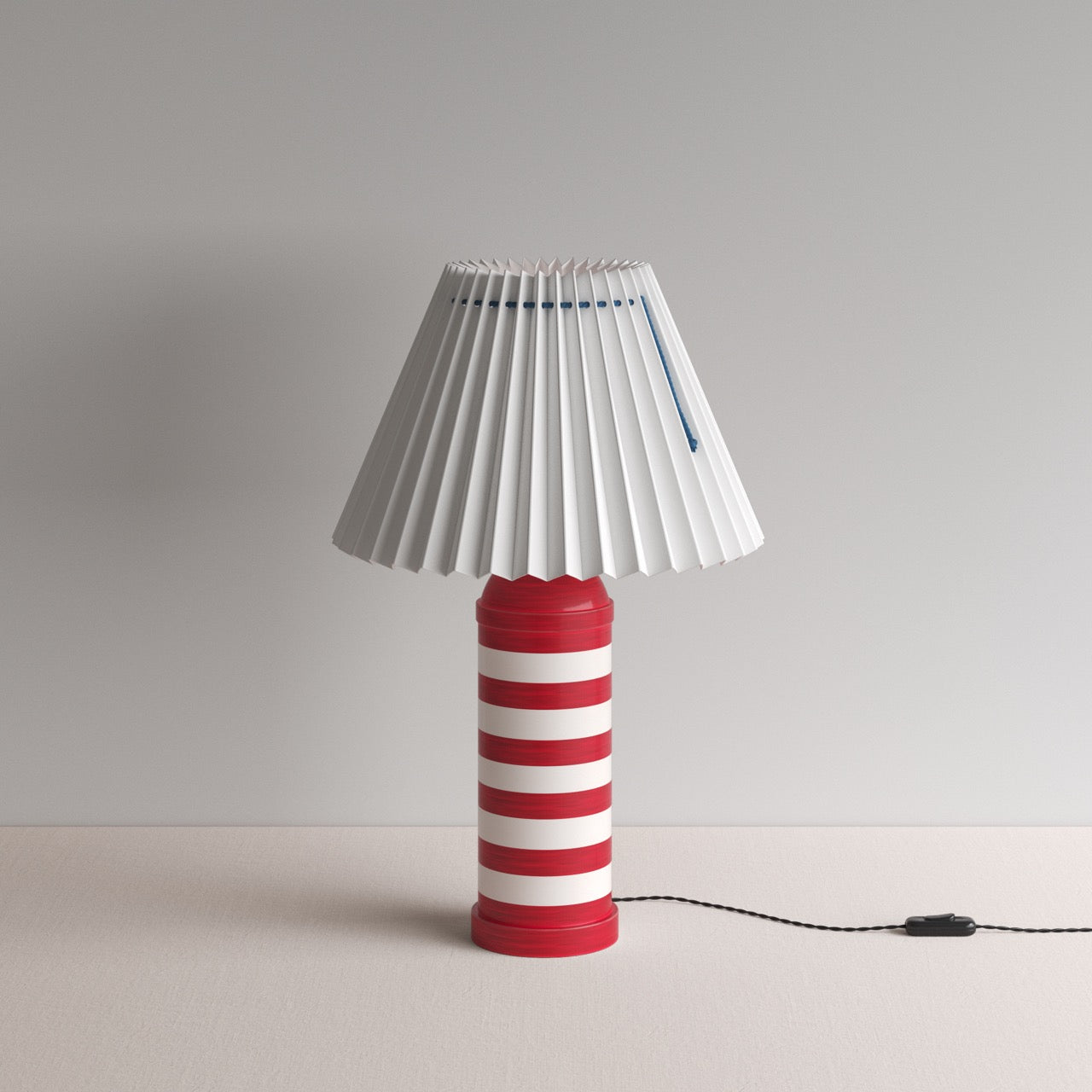 Humbug Striped Ceramic Table Lamp Base in Cherry Red & Warm White, With Sunburst Concertina Natural Pleat Lamp Shade with Blue Cord - By NiX