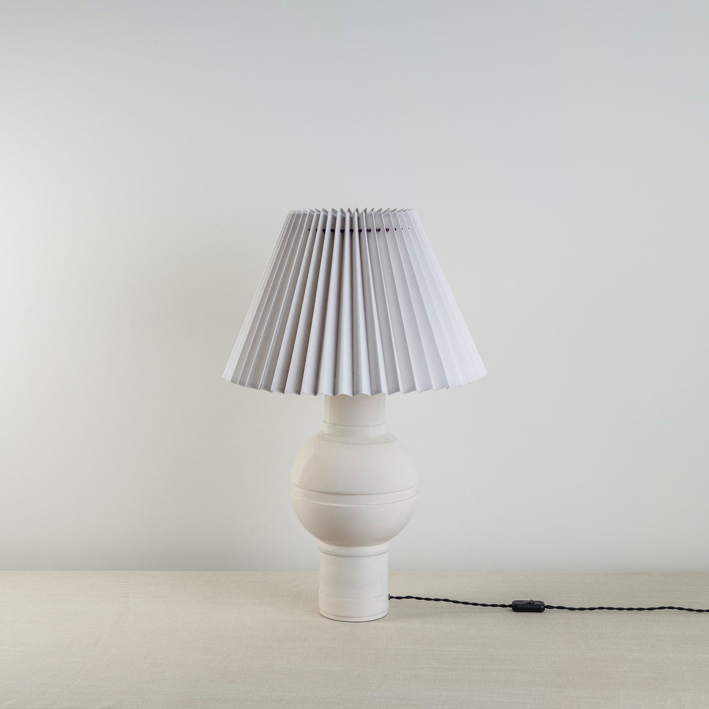 Orb Ceramic Table Lamp Base in Warm White, With Sunburst Concertina Natural Pleat Lamp Shade with Blackberry Cord - By NiX