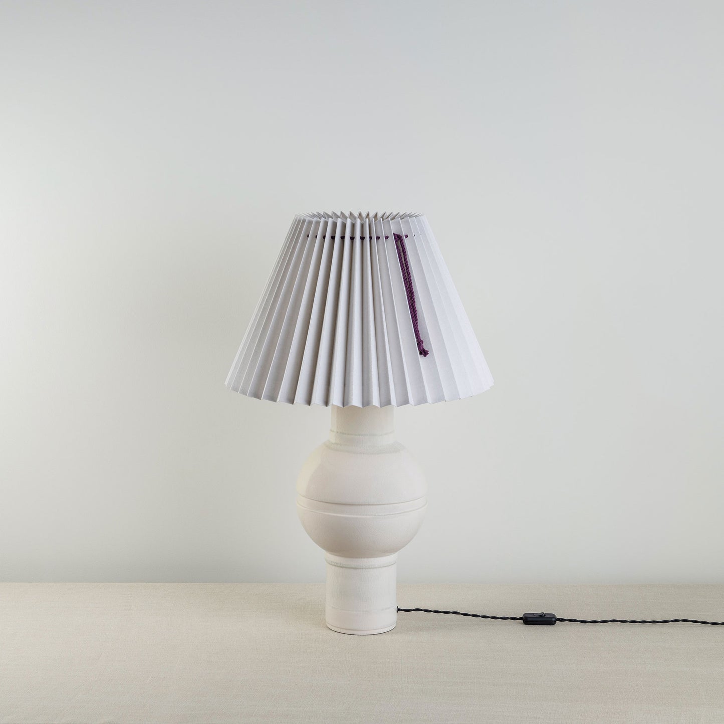 Orb Ceramic Table Lamp Base in Warm White, With Sunburst Concertina Natural Pleat Lamp Shade with Blackberry Cord - Nicola Harding