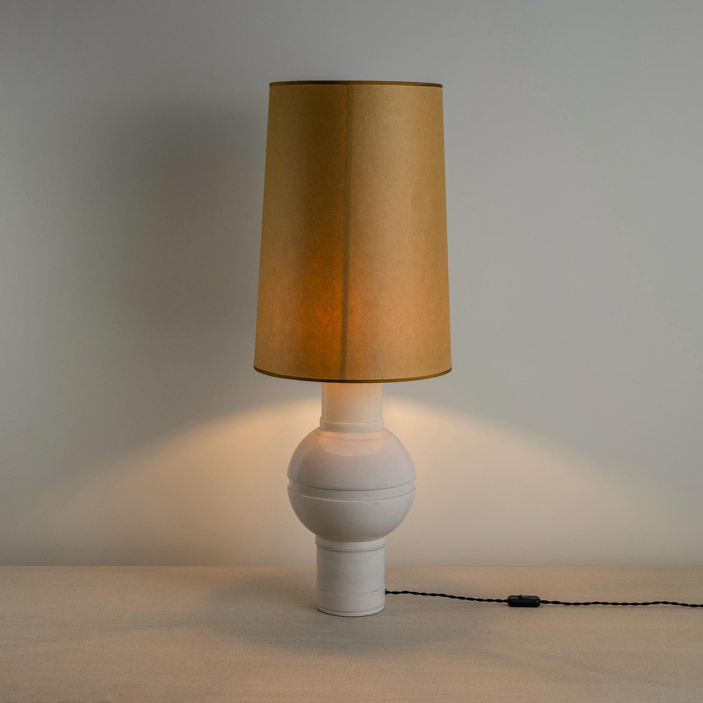 Orb Ceramic Table Lamp Base in Warm White, With Whimsical Tall Straight Empire Lamp Shade in Mustard with Antiqued Gold Trim With Lights 'ON' - By NiX