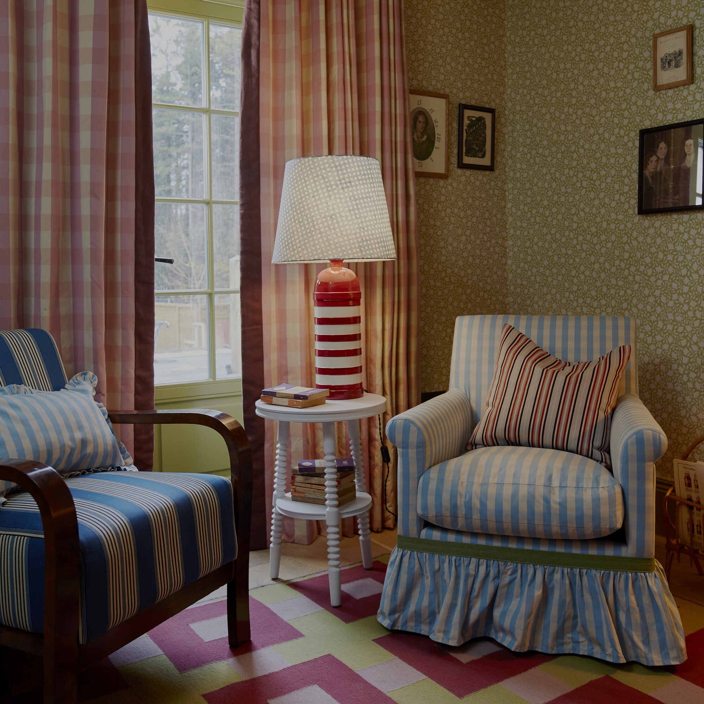 Beautiful living room with two chairs, decorated with Ginkgo wallpaper in Moss Green, designed by Nicola Harding & Co.