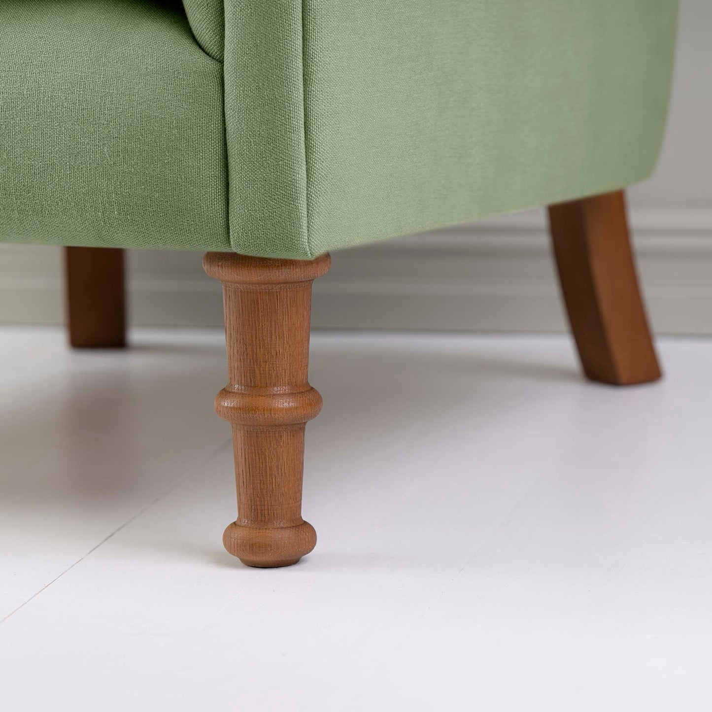 Time Out Armchair in Laidback Linen Moss, Front Foot Design Closeup - NiX