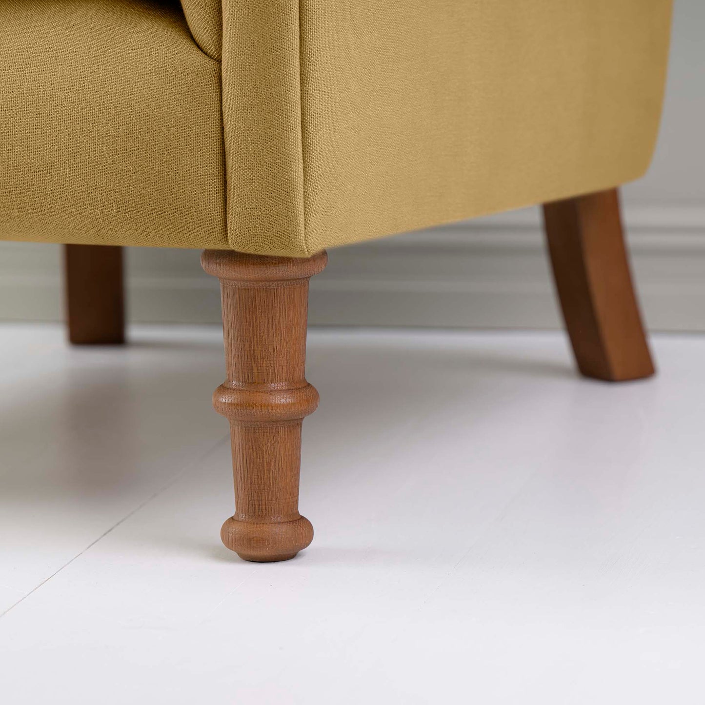 Time Out Armchair in Laidback Linen Ochre, Front Foot Design Closeup - NiX