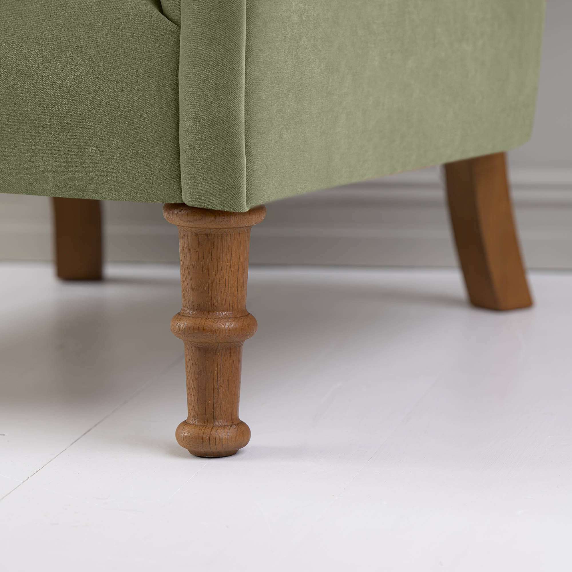 Time Out Armchair in Intelligent Velvet Green Tea, Front Foot Design Closeup - NiX