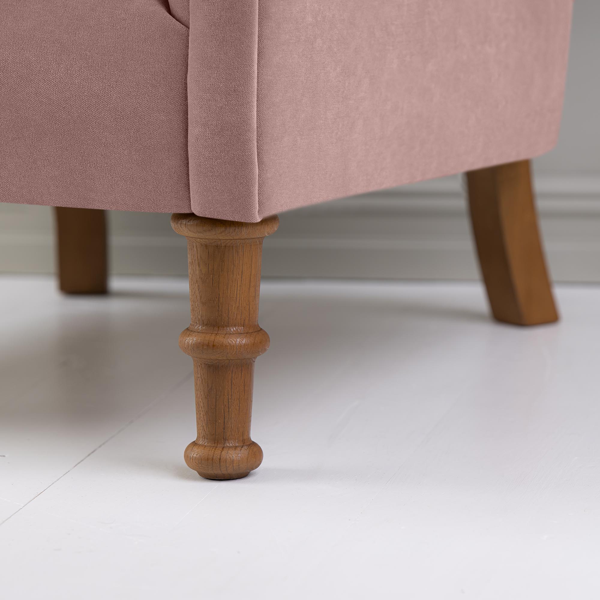 Time Out Armchair in Intelligent Velvet Rose, Front Wooden Foot Design Closeup - NiX