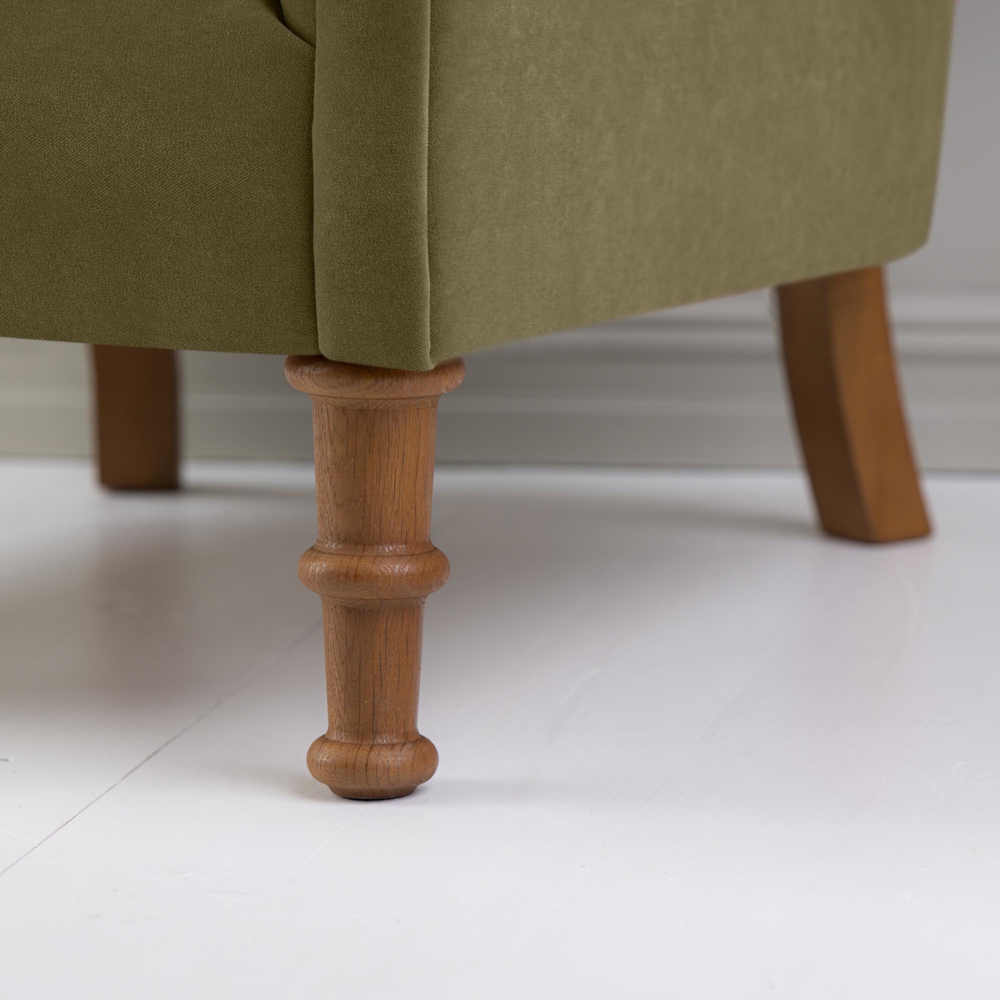 Time Out Armchair in Intelligent Velvet Sepia, Front Foot Design Closeup - NiX