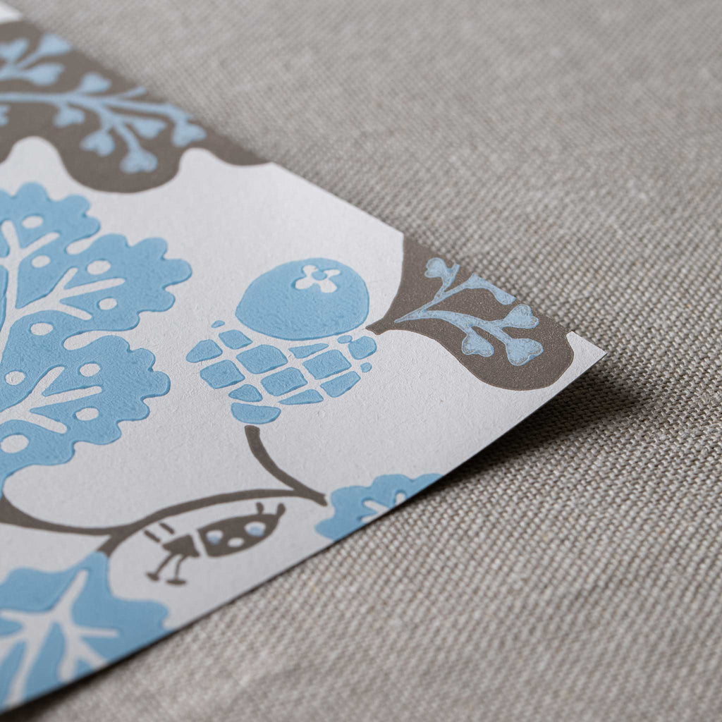 Neat edge of Acorn Wallpaper in Sugarbag Blue and Mushroom - Nicola Harding