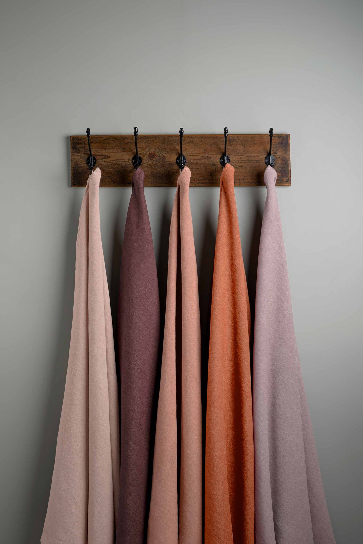 Linen Fabric Swatches in Different Colors Hanging on Hooks – By NiX