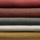 Stack of Linen Fabrics in Multiple Colors Layered Together – By NiX