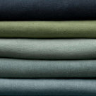 Stack of Linen Fabrics in Multiple Colors Layered Together – By NiX