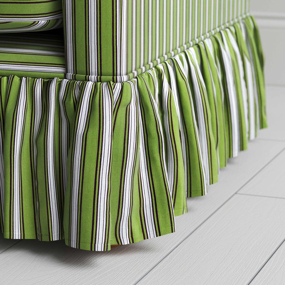  A close-up of a vibrant green and white striped skirt, showcasing its colorful and stylish pattern. 