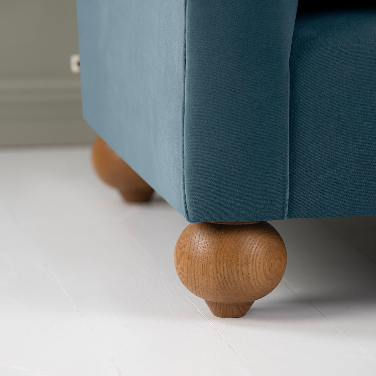 Dolittle 2-Seater Sofa in Intelligent Velvet Aegean, Round Wooden Feet Closeup - Nicola Harding