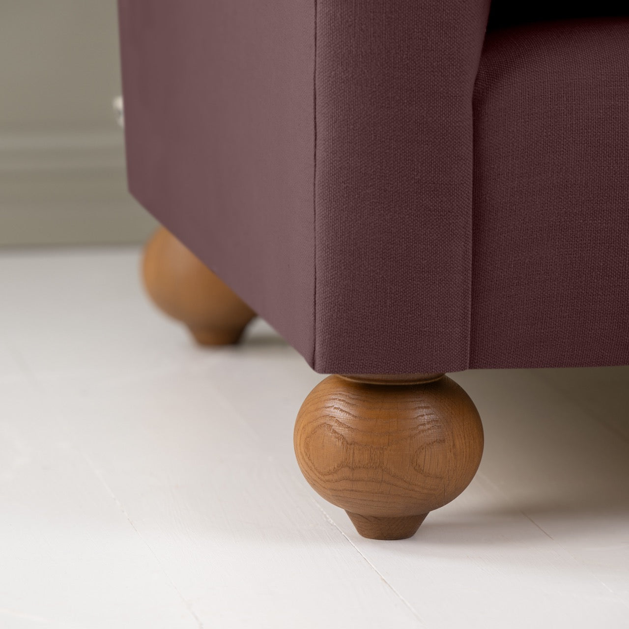 Dolittle 2 Seater Sofa in Laidback Linen Damson, Round Wooden Foot Closeup - Nicola Harding