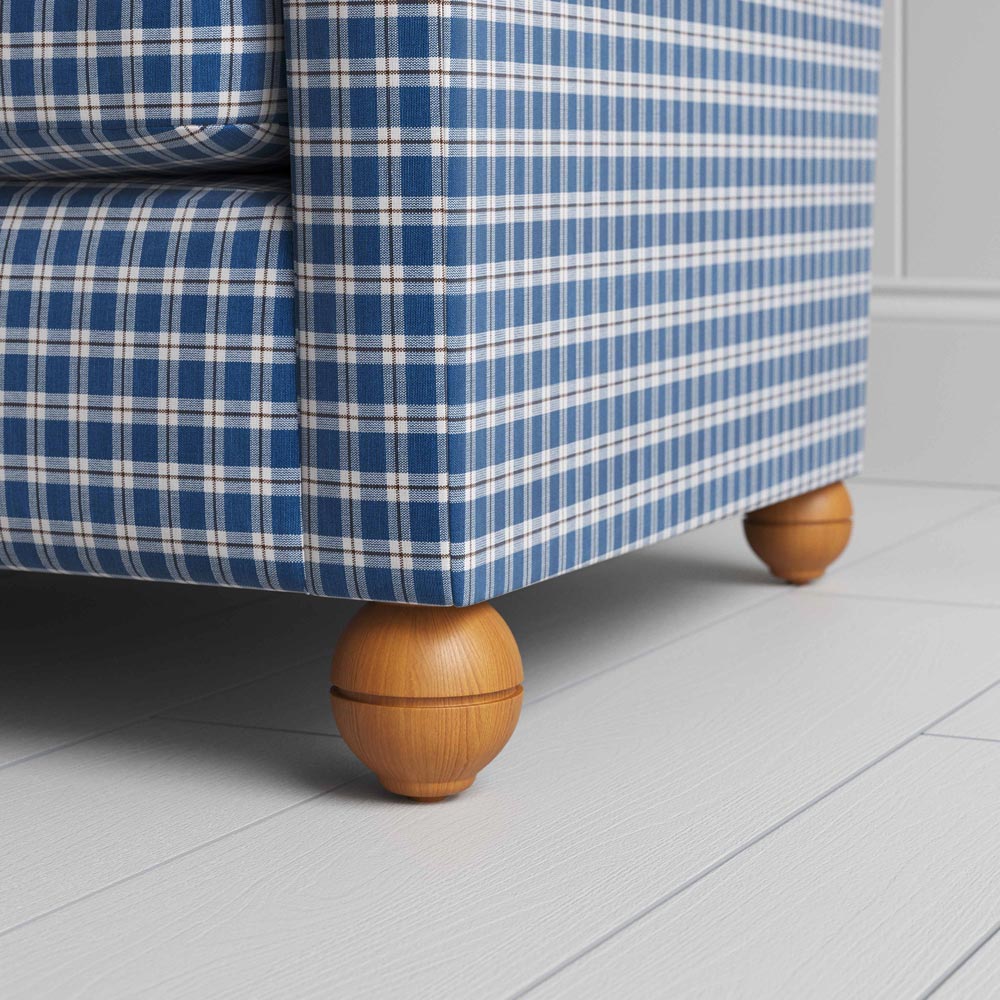  A close-up of a blue and white checkered sofa, showcasing its intricate pattern and inviting texture. 