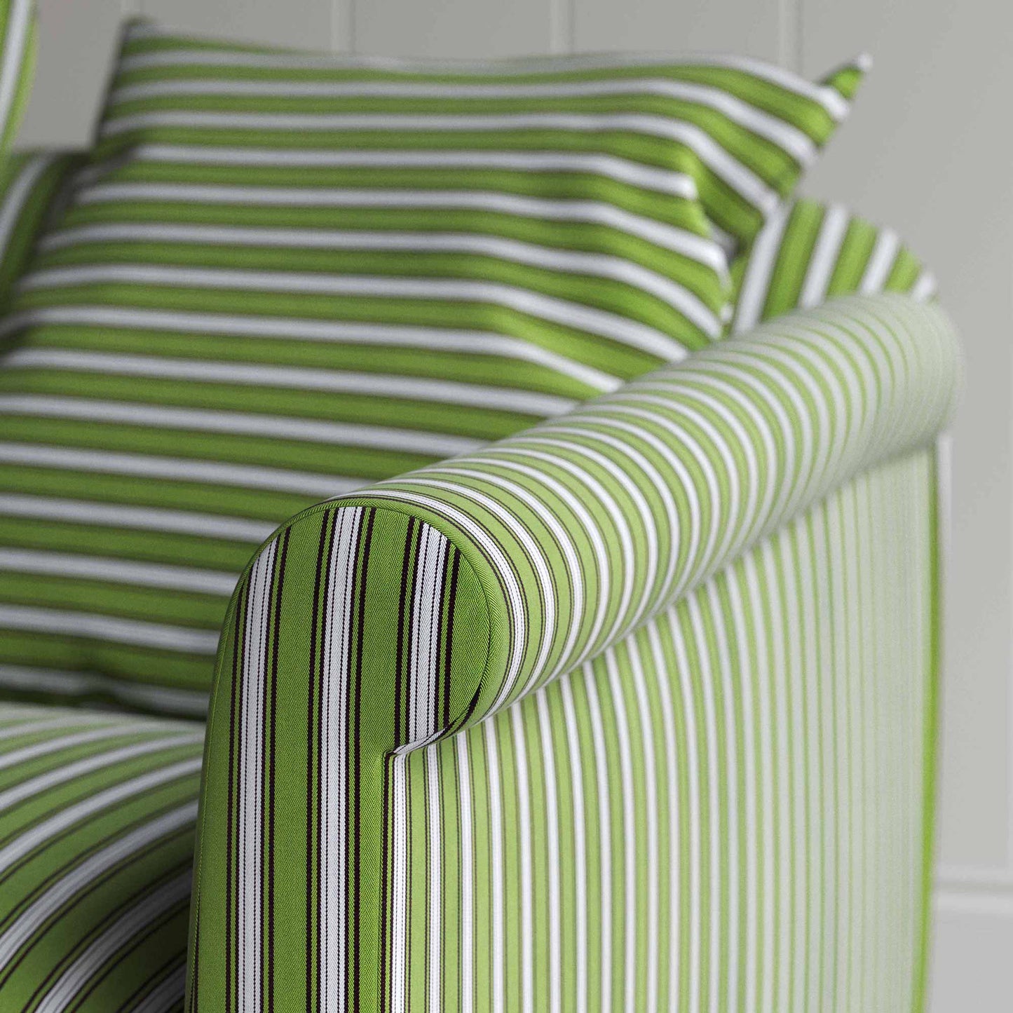 A green and white striped couch in close-up view.