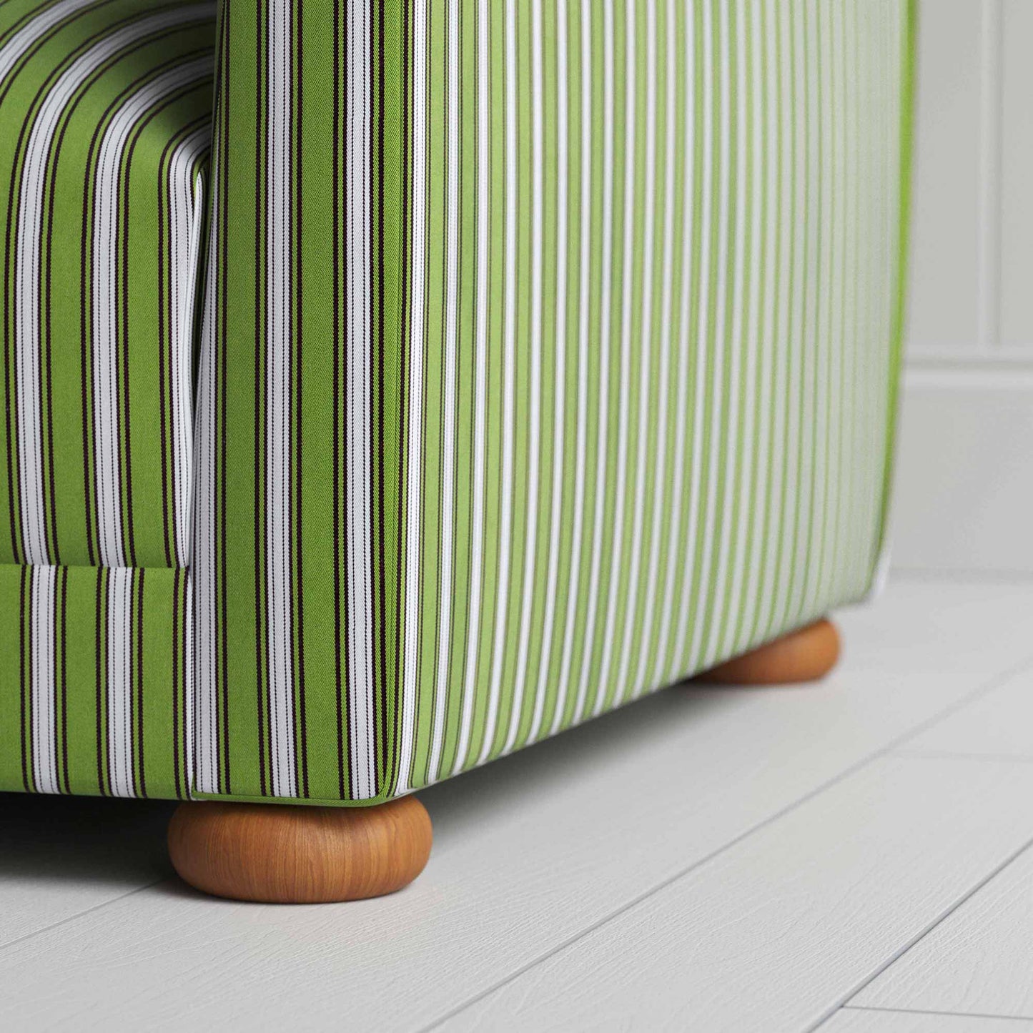 A close-up of a green and white striped sofa, adding a touch of elegance and vibrancy to any room.