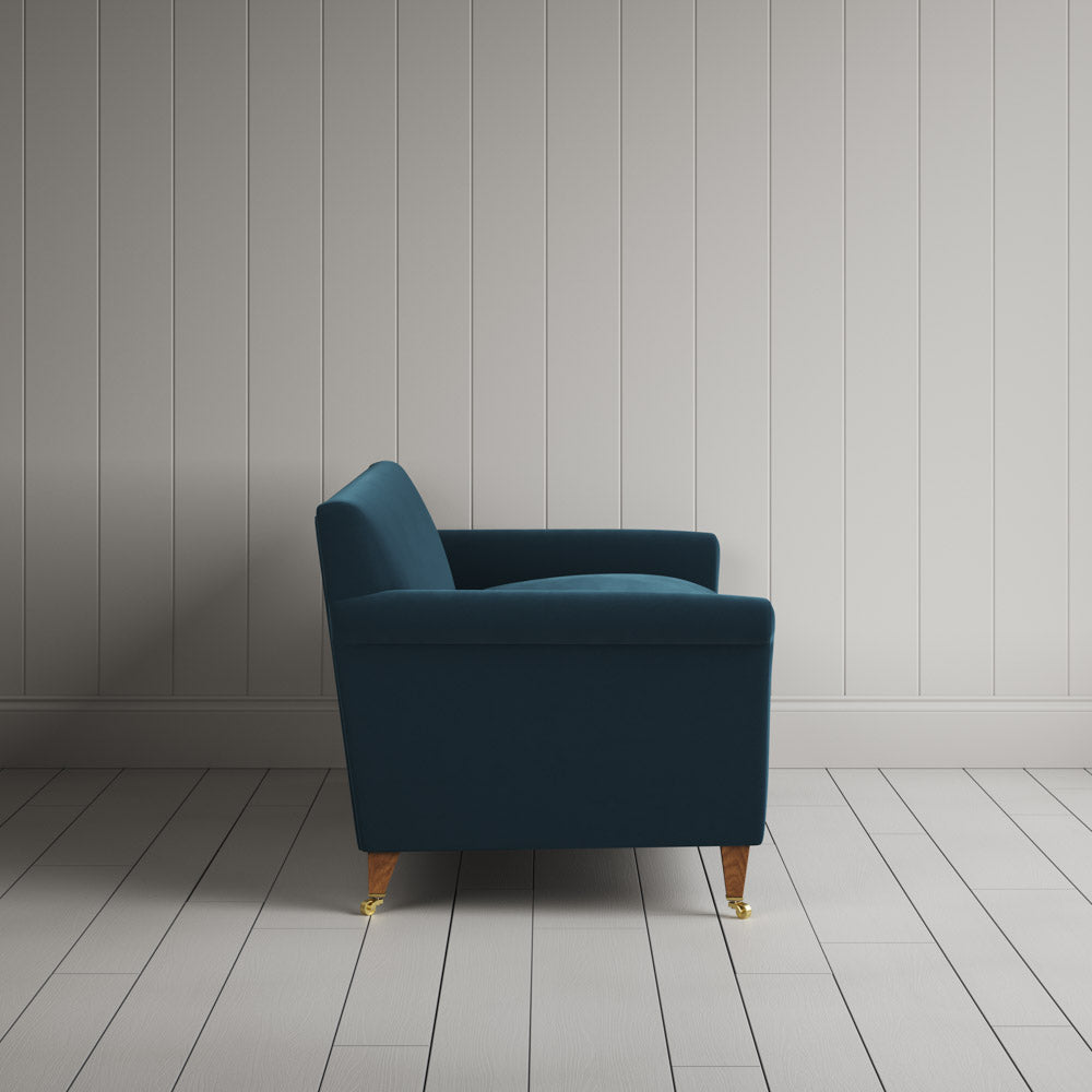  Side profile of the Velvet Aegean Idler sofa by NiX 