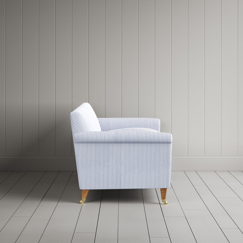Side profile of the striped Idler sofa by NiX
