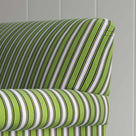  A close-up of a green and white striped chair, adding a touch of elegance and vibrancy to any room. 