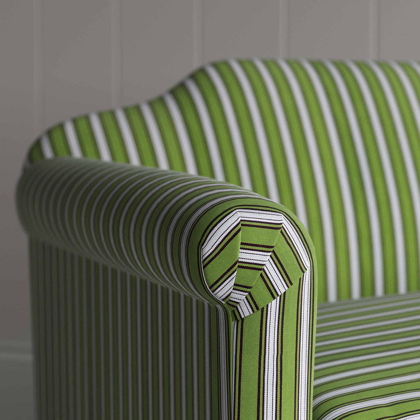 Detailed view of a green and white striped sofa.