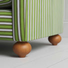 Zoomed shot of the solid wood ball foot on a Nicola Harding design sofa.