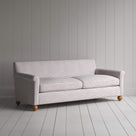  White colored sofa in checkered pattern by white wall. 