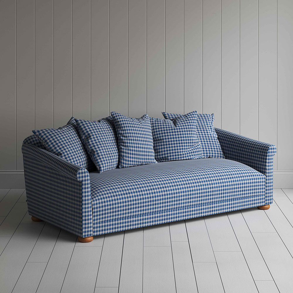  Blue and white checkered sofa with pillows, adding a touch of elegance and comfort to any living space. 