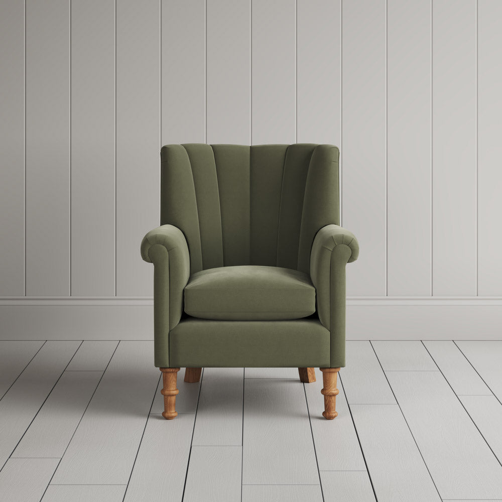 Time Out Armchair fluted back design in intelligent velvet green tea, front view by Nicola Harding. 