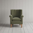 Time Out Armchair fluted back design in intelligent velvet green tea, front view by Nicola Harding.