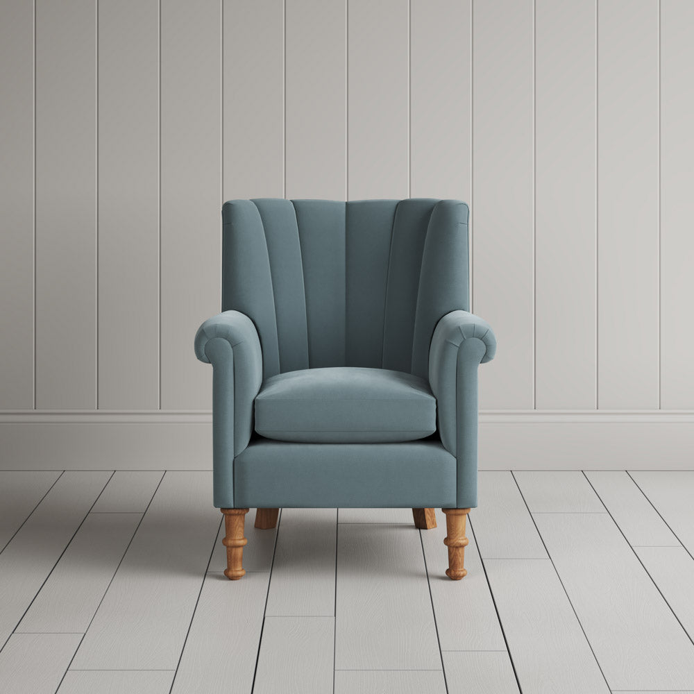  NiX furniture mineral velvet armchair with high fluted back, front studio shot. 