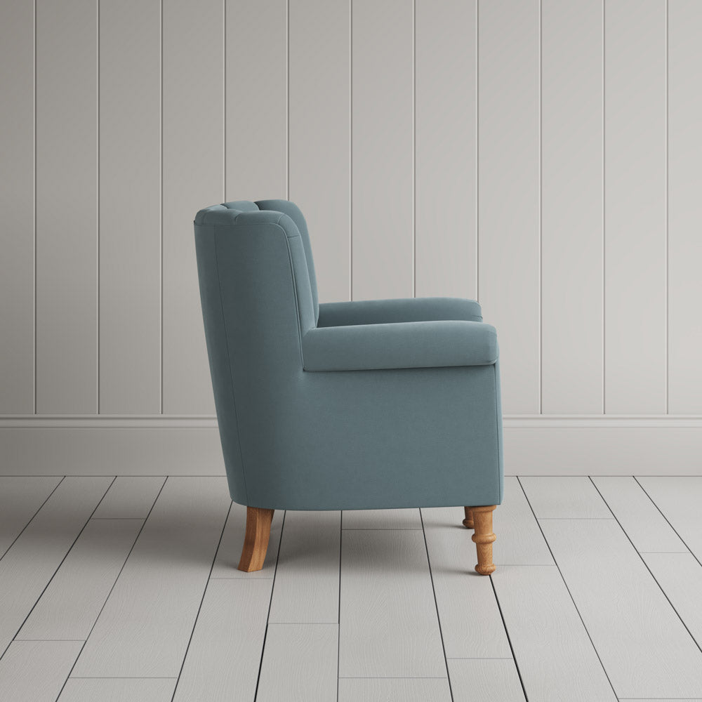  Time Out Armchair in intelligent velvet mineral, side view by NiX. 