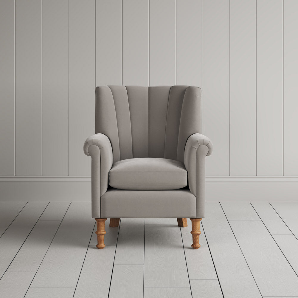 Time Out Armchair fluted back design in intelligent velvet moonstone, front view by Nicola Harding.