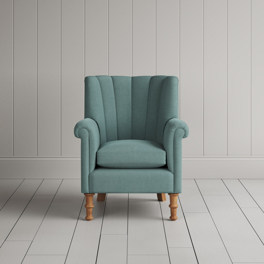 Time Out Armchair fluted back design in laidback linen cerulean, front view by Nicola Harding.