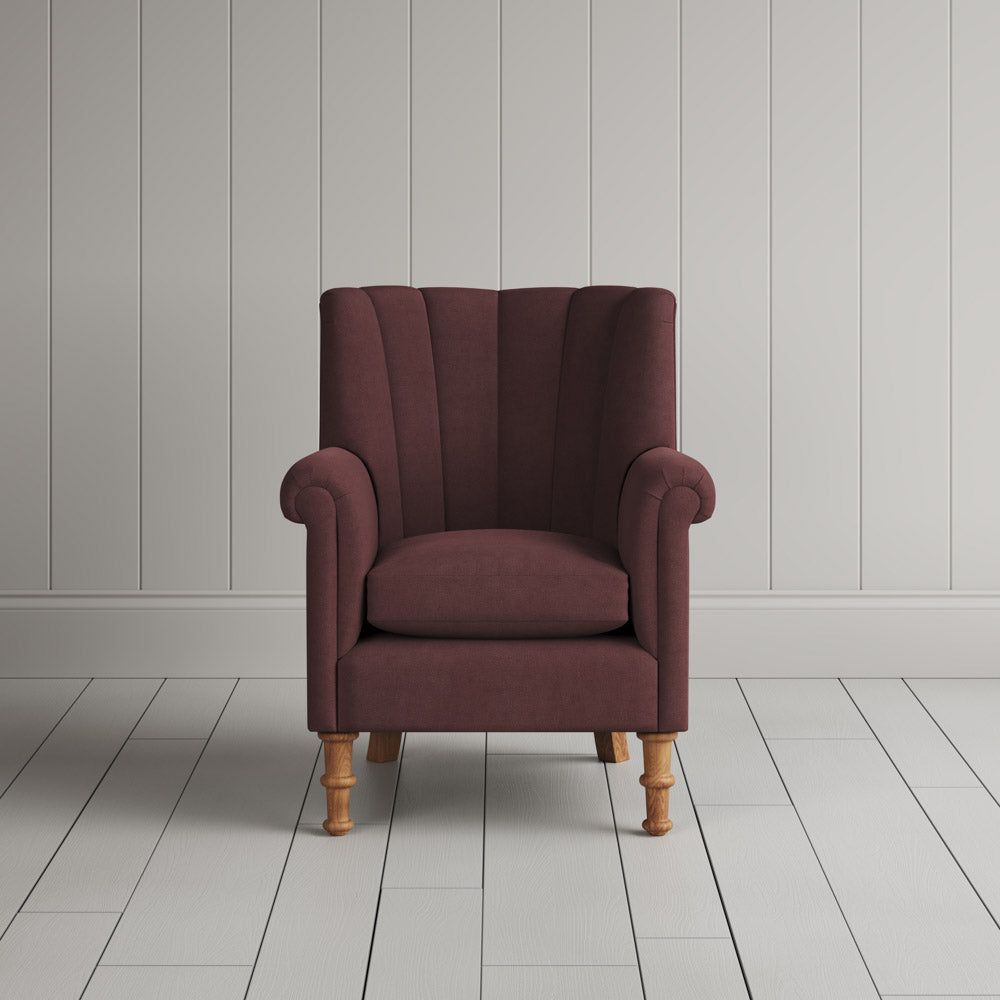  Time Out Armchair fluted back design in laidback linen damson, front view by Nicola Harding. 