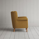 Time Out Armchair in laidback linen ochre, side view by NiX.