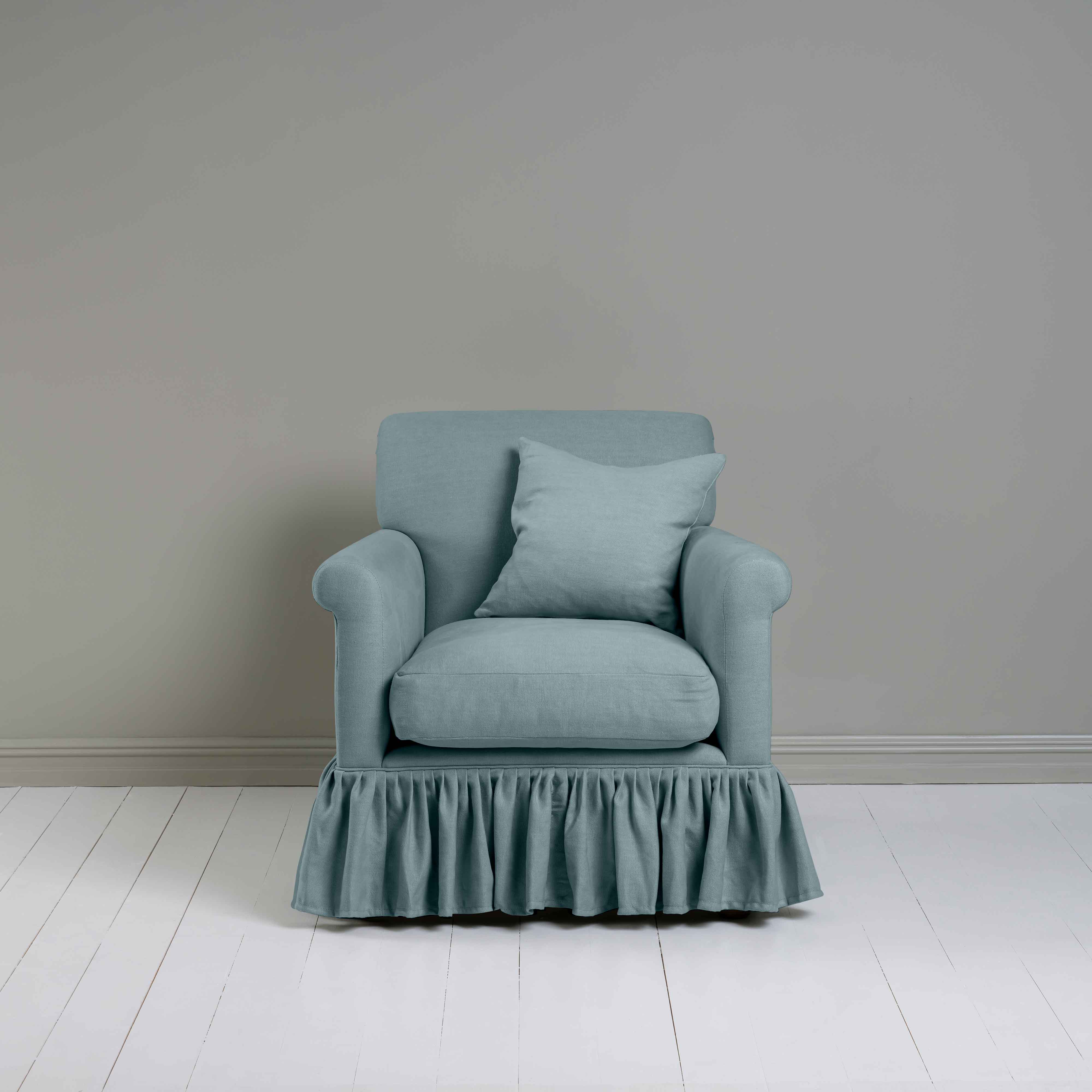  Curtain Call Armchair in Laidback Linen Cerulean, With a Matching Square Cushion from Front View - Nicola Harding 
