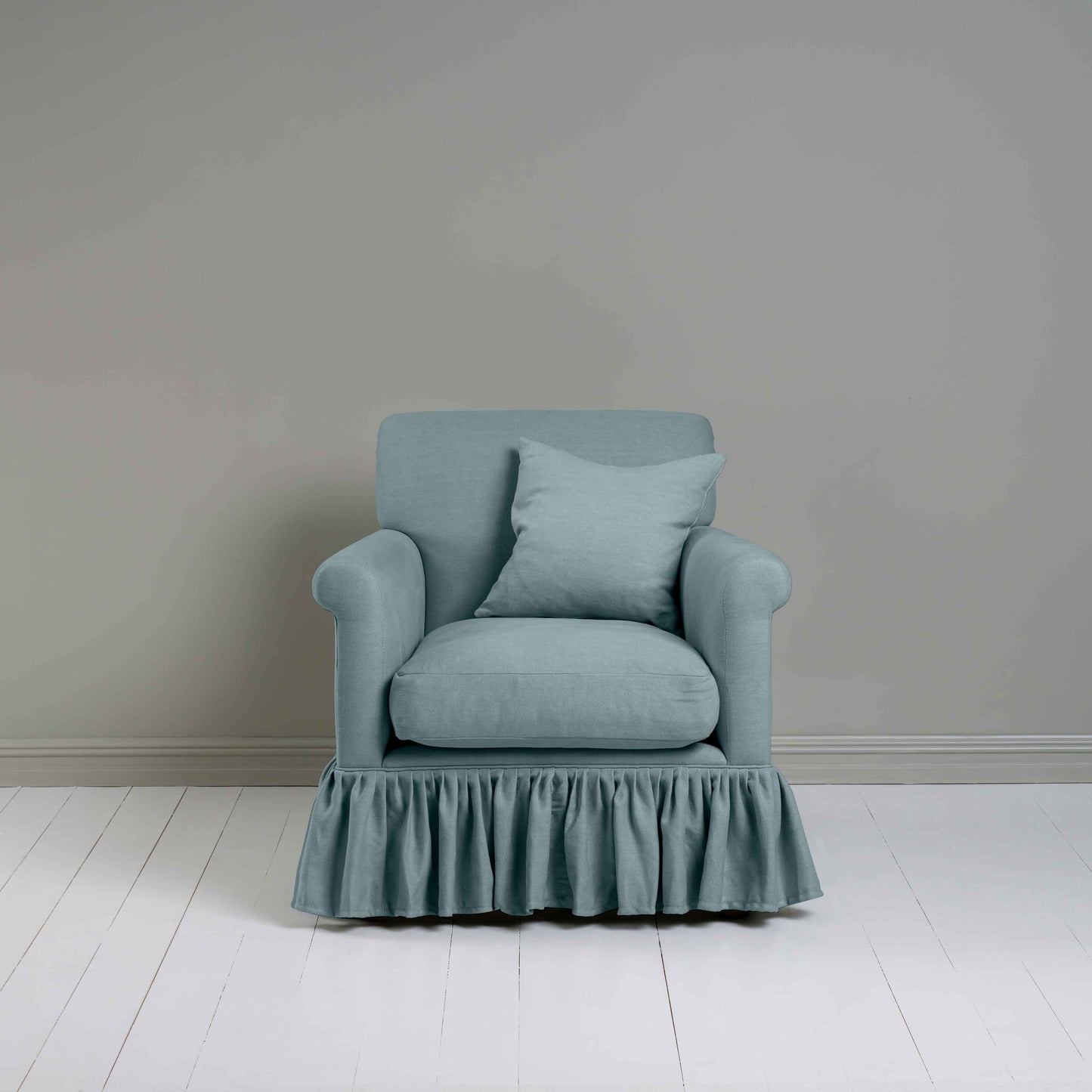 Curtain Call Armchair in Laidback Linen Cerulean, With a Matching Square Cushion from Front View - Nicola Harding