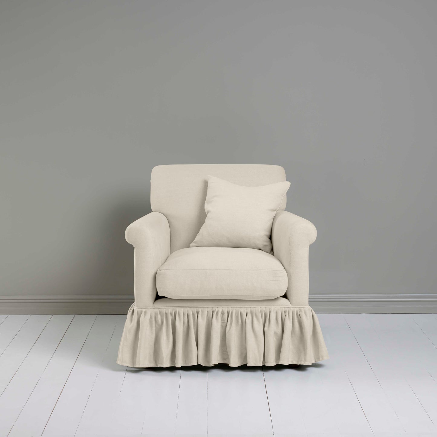 Curtain Call Armchair in Laidback Linen Dove, With a Matching Square Cushion from Front View - Nicola Harding