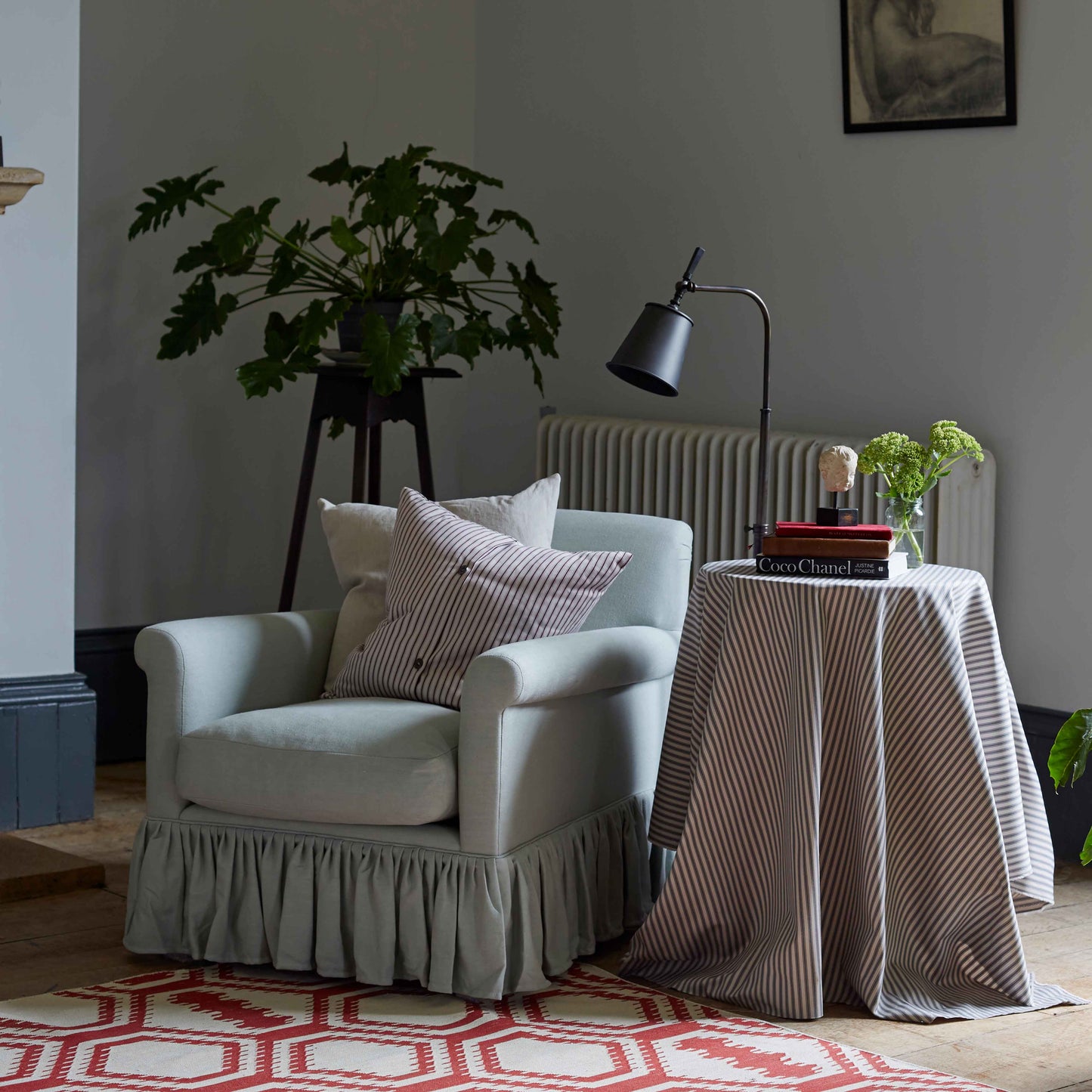 Curtain Call Armchair, With Two Square Cushions, a Side Table, And a Floor Lamp with Matte Black Lamp Shade - Nicola Harding