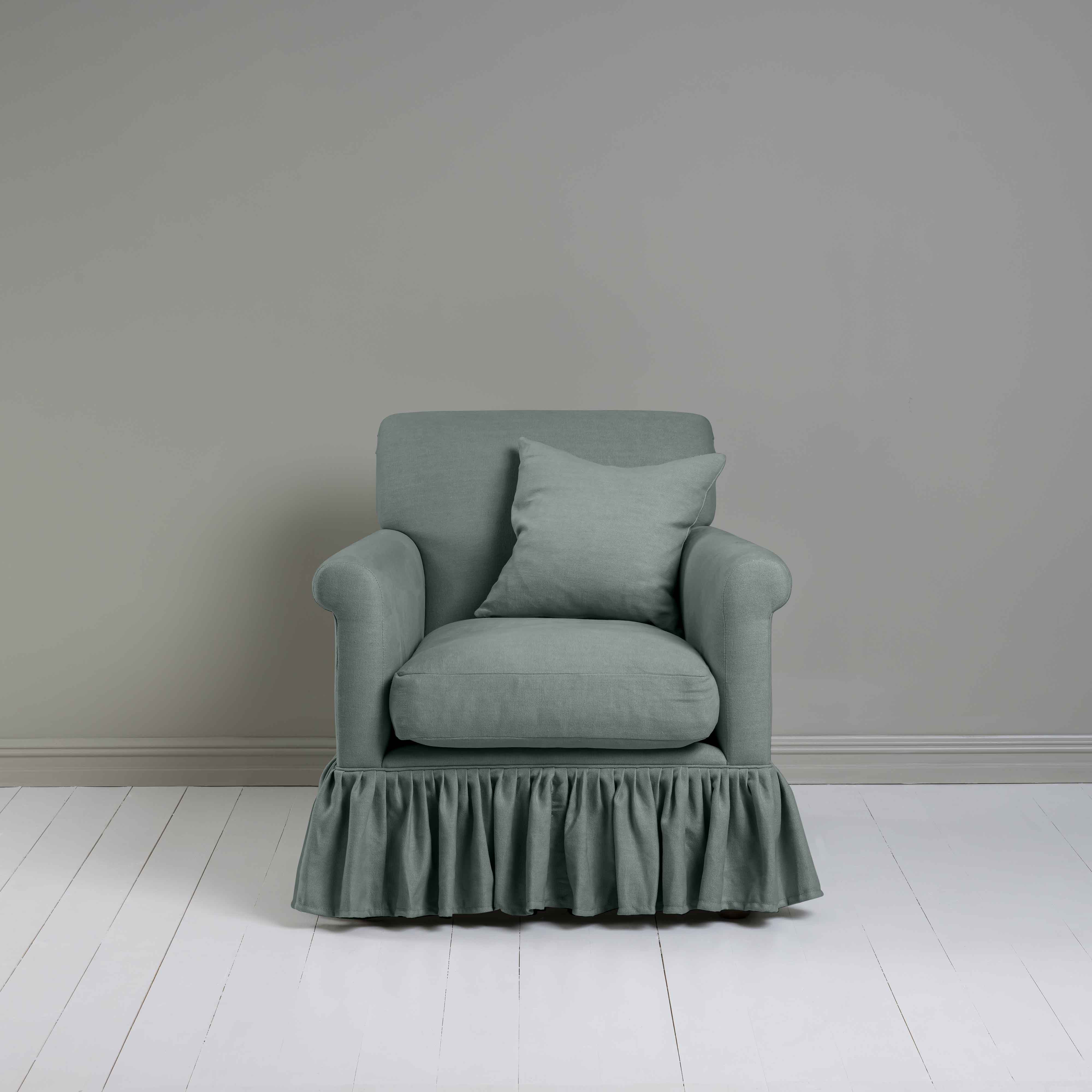  Curtain Call Armchair in Laidback Linen Mineral, With a Matching NiX Special Square Cushion from Front View - Nicola Harding 