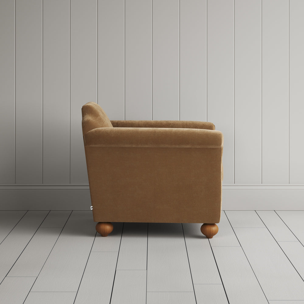 Side profile of the Stone Beige corduroy Dolittle armchair