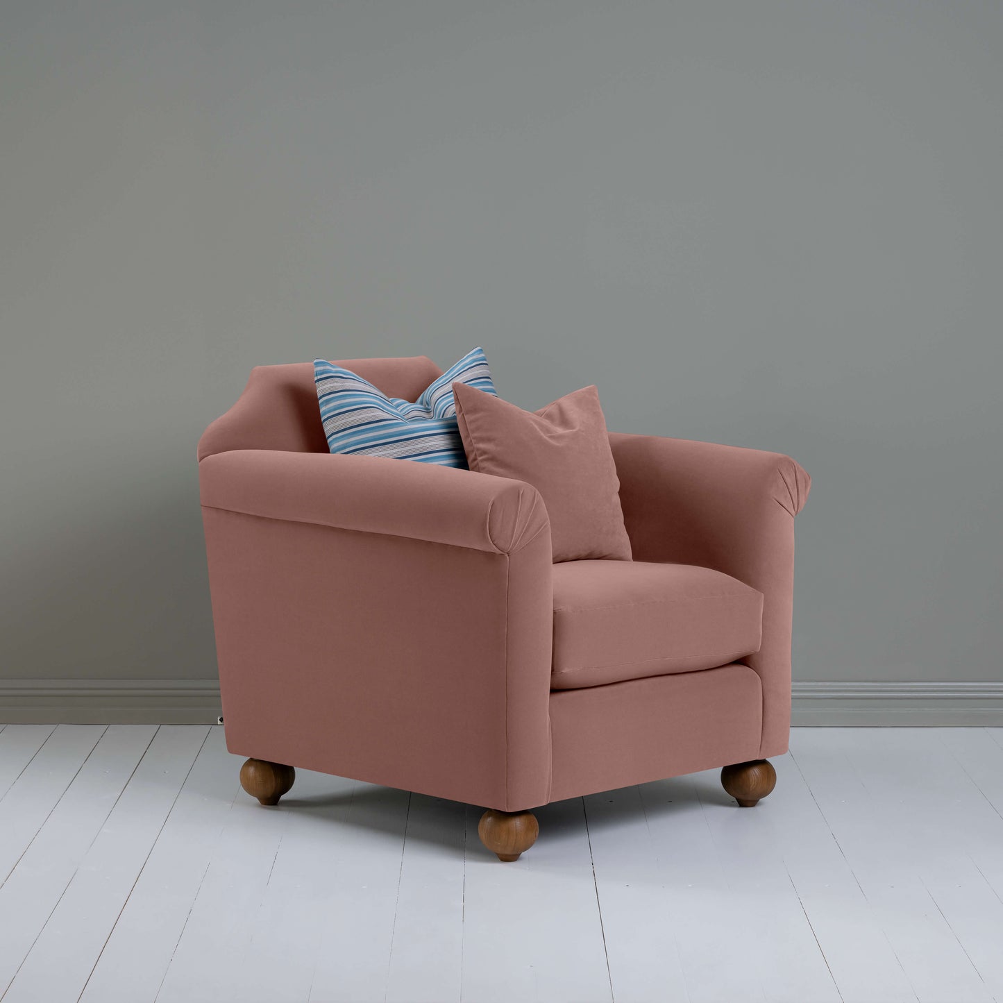 Dolittle Armchair in Intelligent Velvet Dusty Pink, In Side View With 1 Matching and 1 Slow Lane Cotton Linen, Blue Cushion - Nicola Harding