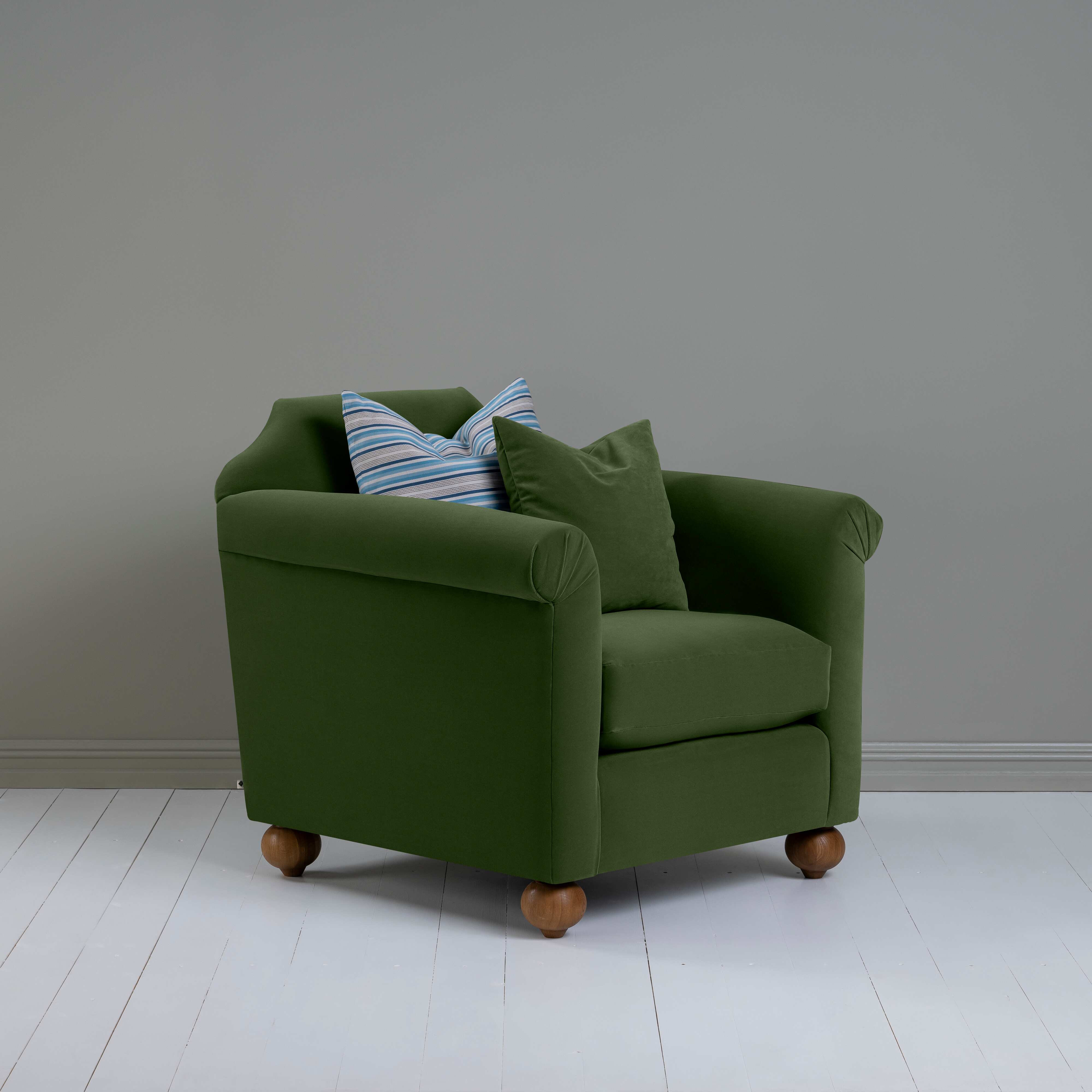  Dolittle Armchair in Intelligent Velvet Juniper, Side View With 1 Matching and 1 Slow Lane Cotton Linen, Blue Cushion - Nicola Harding 